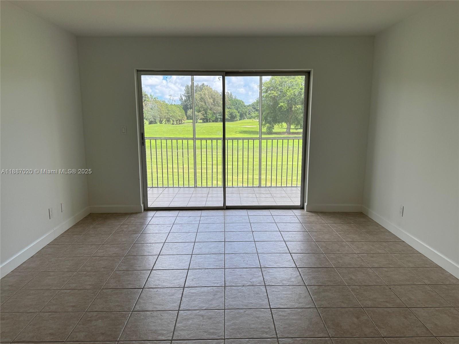 5100 Southwest 90th Avenue, Unit 203 Cooper City, FL 33328 - Photo 12 of 18 a view of an empty room with a window