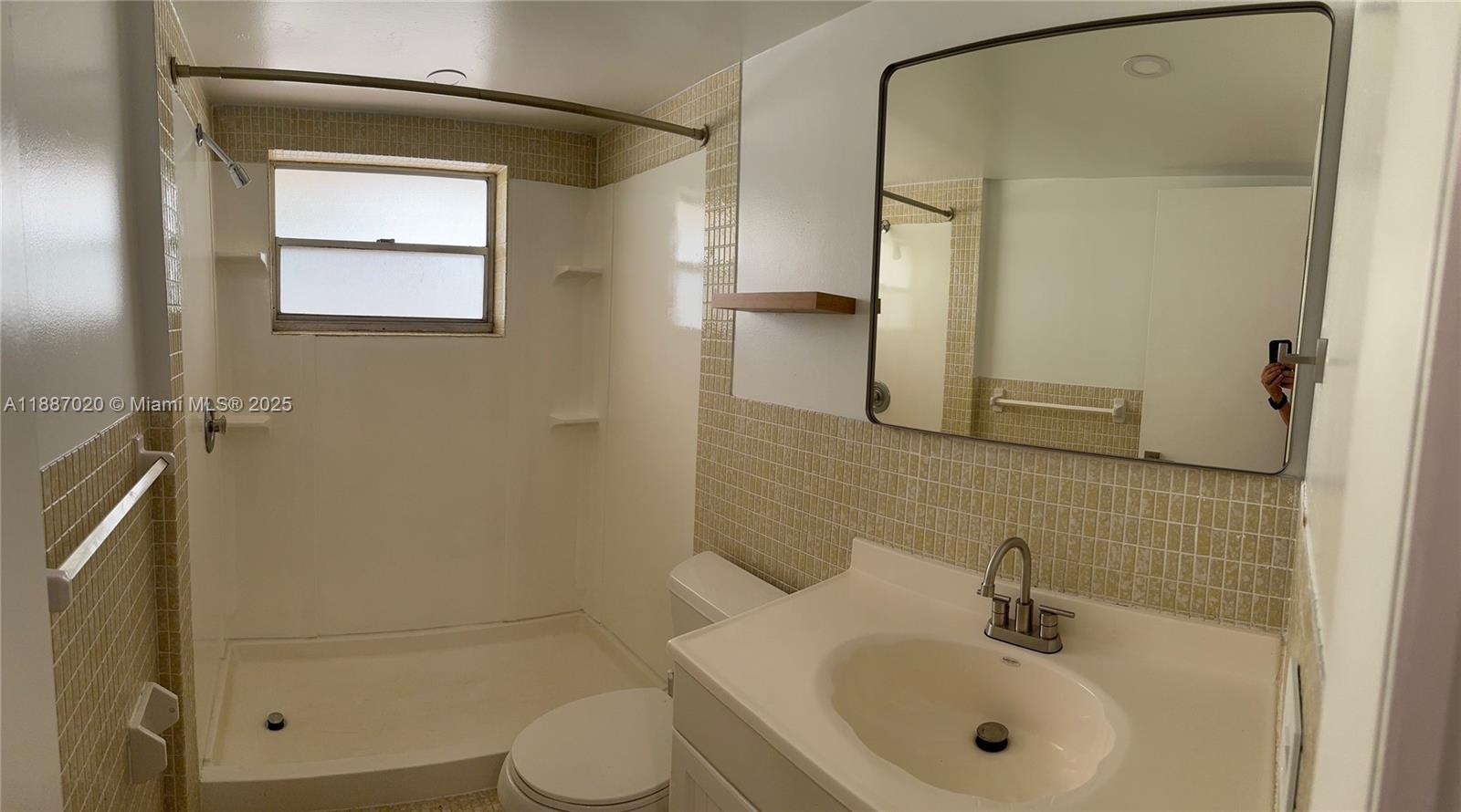 5100 Southwest 90th Avenue, Unit 203 Cooper City, FL 33328 - Photo 15 of 18 a bathroom with a sink toilet and shower