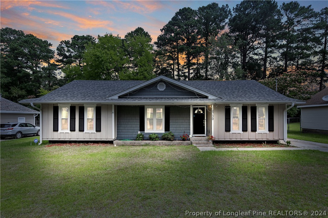 4730 Belford Road Fayetteville, NC 28314 - Photo 1 of 47 a front view of a house with a garden