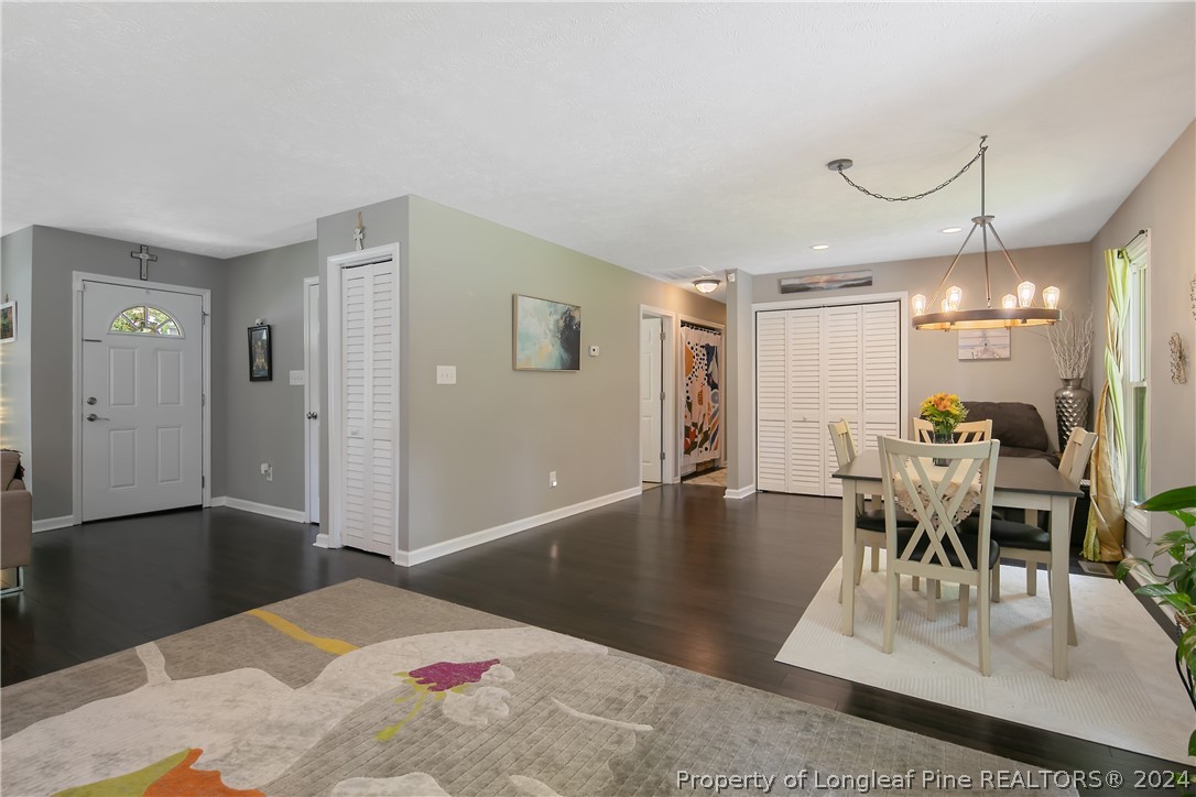 4730 Belford Road Fayetteville, NC 28314 - Photo 20 of 47 a living room with furniture a table and wooden floor