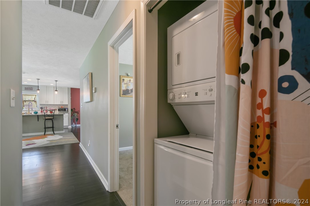 4730 Belford Road Fayetteville, NC 28314 - Photo 25 of 47 a view of a hallway to a livingroom with furniture and windows