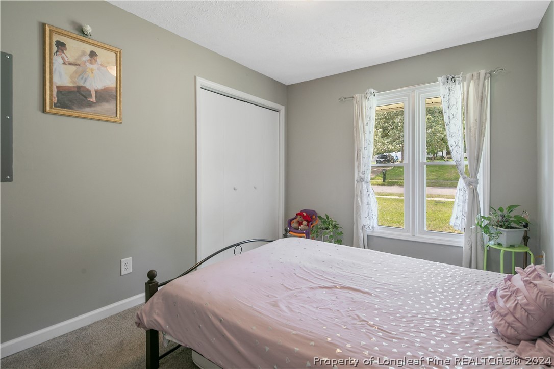4730 Belford Road Fayetteville, NC 28314 - Photo 33 of 47 a bedroom with a bed and a window