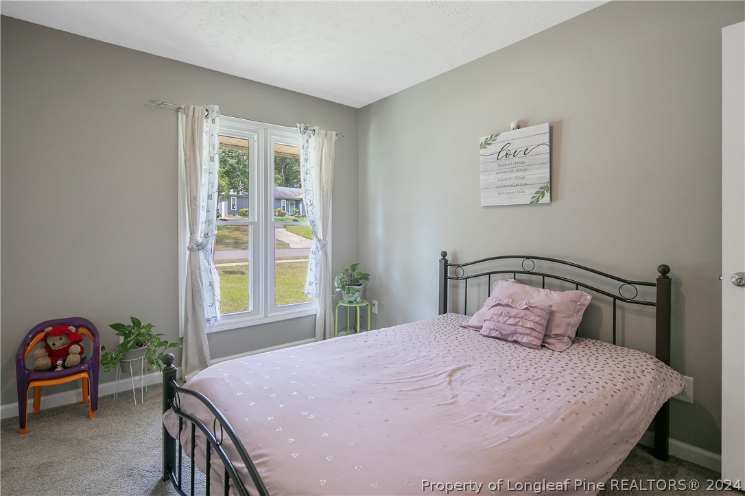 4730 Belford Road Fayetteville, NC 28314 - Photo 34 of 47 a bedroom with a bed and a window
