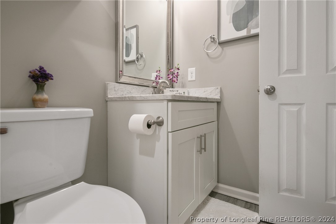 4730 Belford Road Fayetteville, NC 28314 - Photo 38 of 47 a bathroom with a toilet sink and shower
