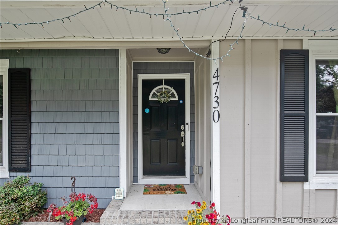 4730 Belford Road Fayetteville, NC 28314 - Photo 4 of 47 a front view of a house with flowers