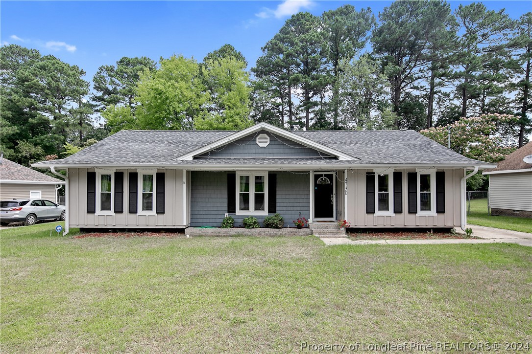 4730 Belford Road Fayetteville, NC 28314 - Photo 43 of 47 a front view of a house with a garden