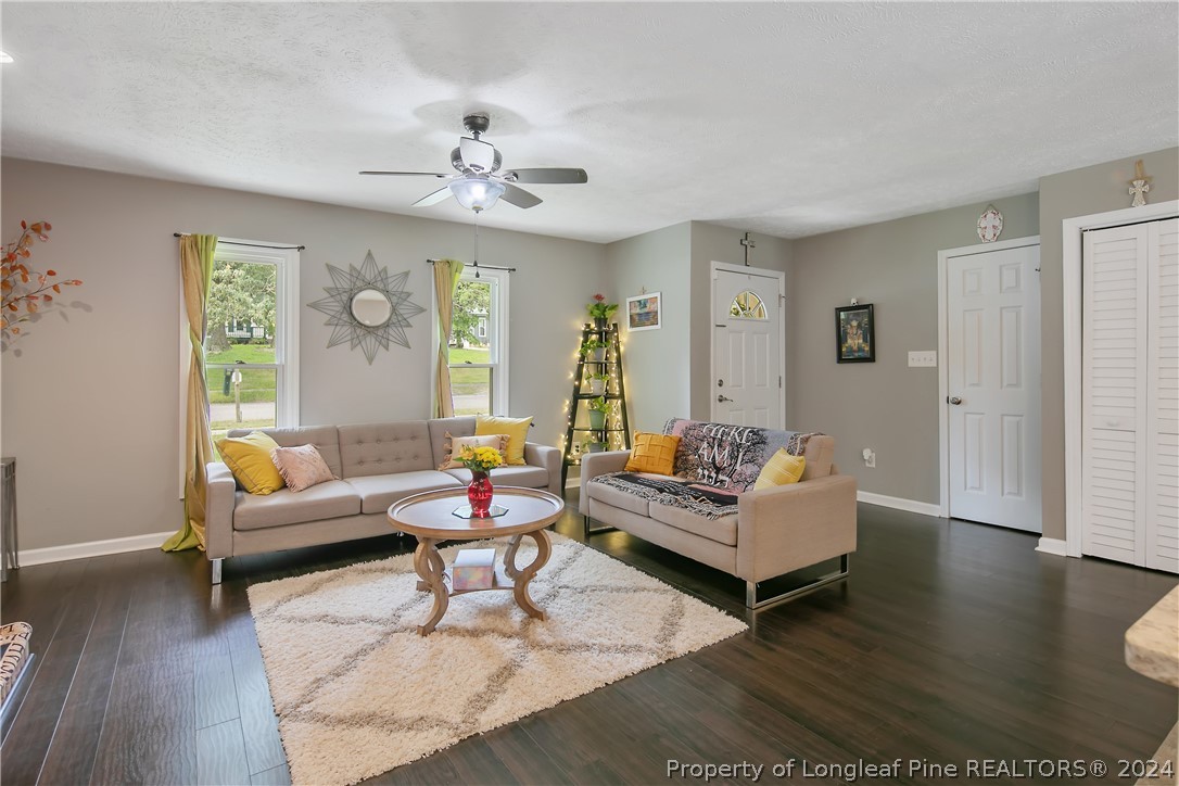 4730 Belford Road Fayetteville, NC 28314 - Photo 9 of 47 a living room with furniture and wooden floor