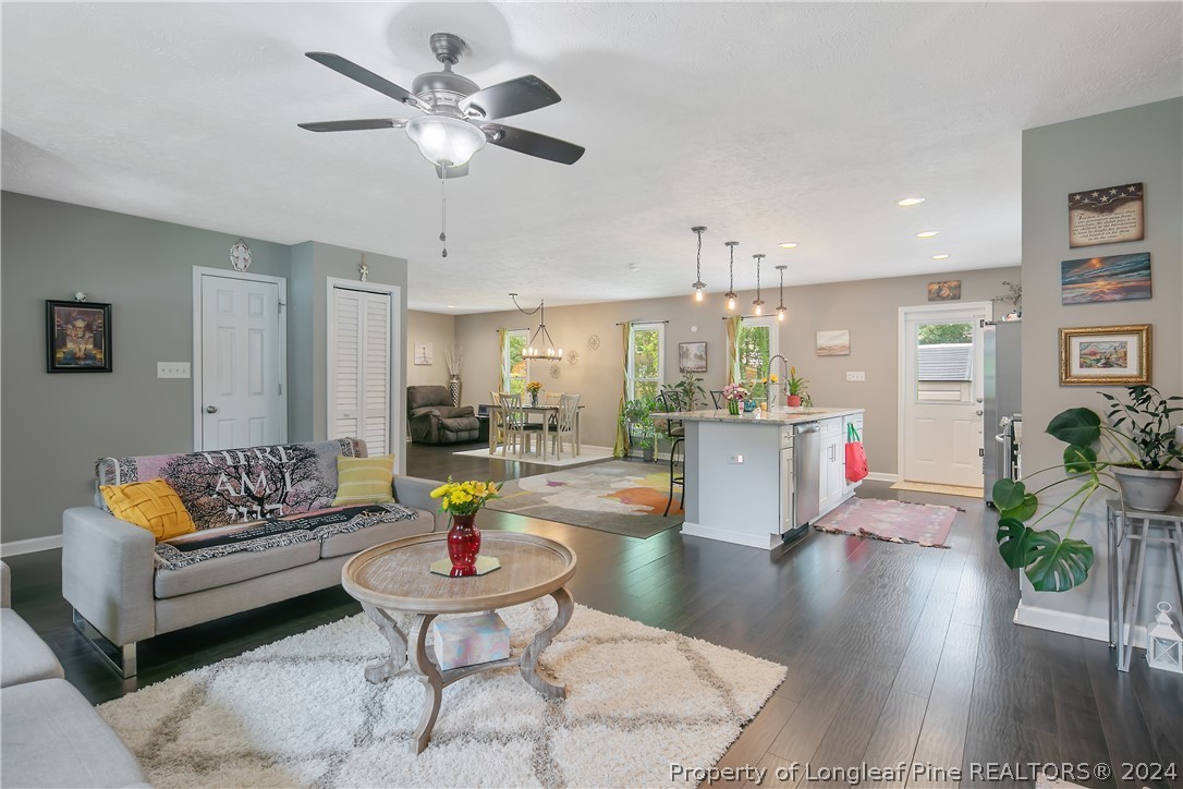 4730 Belford Road Fayetteville, NC 28314 - Photo 10 of 47 a living room with furniture and kitchen view