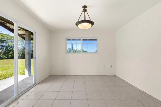 a bathroom with a sink a toilet a mirror and shower
