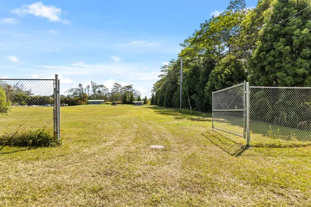 a house with swimming pool in front of it