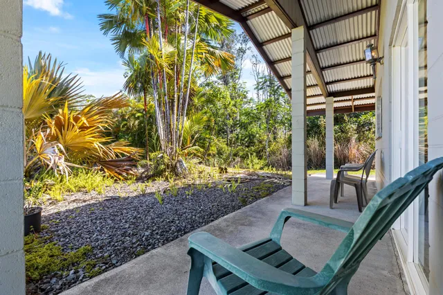a view of a pathway of a house with a yard