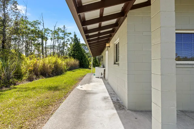 a view of yard with patio