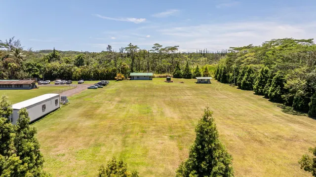 a kitchen with granite countertop a sink and a stove