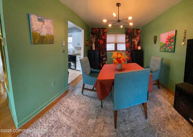 a bedroom with a bed and a table in it