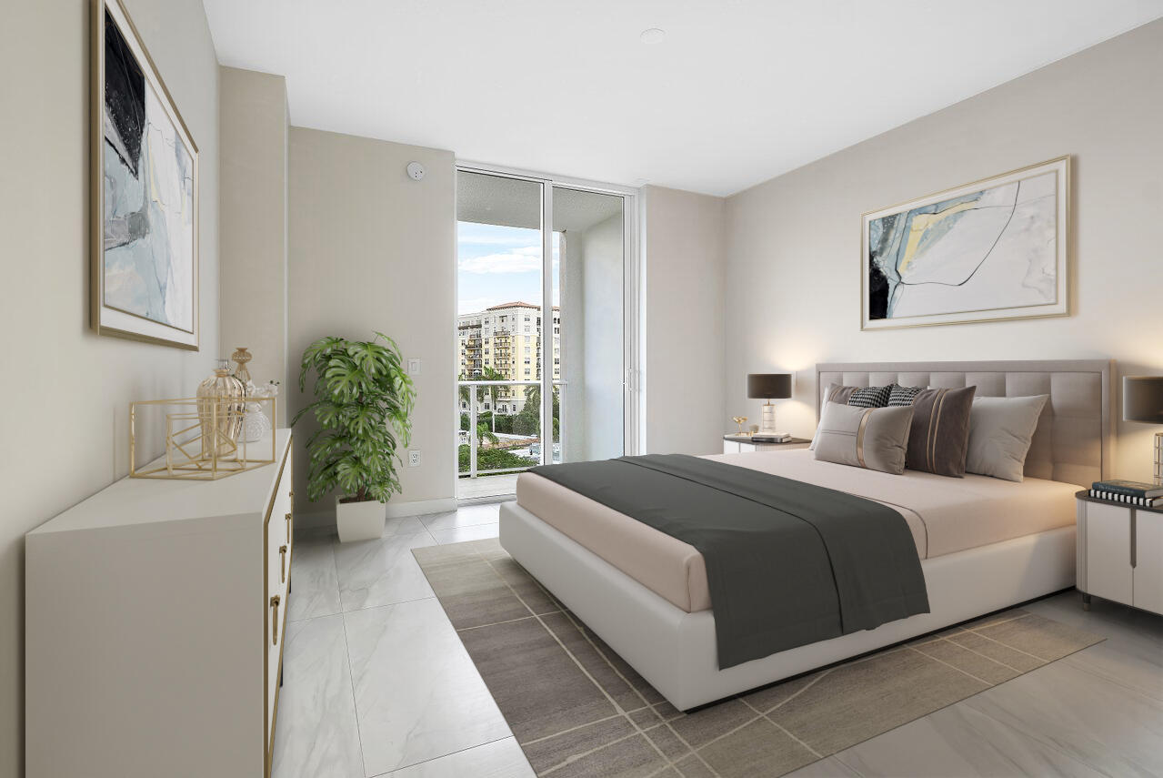 220 Southeast Mizner Boulevard, Unit 506 Boca Raton, FL 33432 - Photo 24 of 64 a spacious bedroom with a large bed and a window