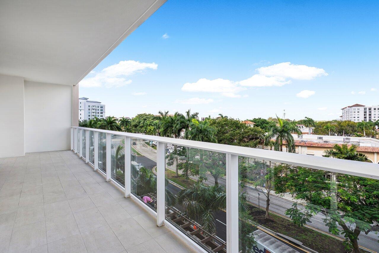 220 Southeast Mizner Boulevard, Unit 506 Boca Raton, FL 33432 - Photo 35 of 64 a view of a balcony with yard