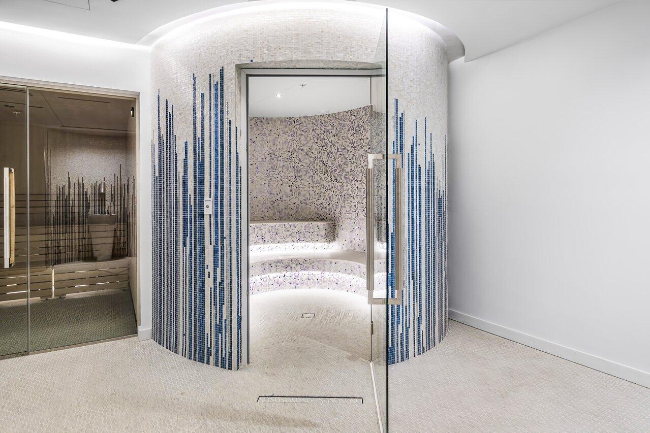 220 Southeast Mizner Boulevard, Unit 506 Boca Raton, FL 33432 - Photo 53 of 64 a bathroom with a glass shower door and a bathtub