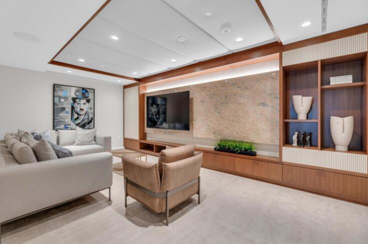 220 Southeast Mizner Boulevard, Unit 506 Boca Raton, FL 33432 - Photo 62 of 64 a living room with furniture and a flat screen tv