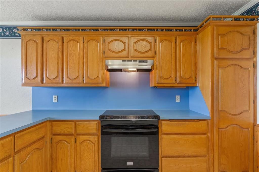 146 Indian Paint Brush Road Eddy, TX 76524 - Photo 16 of 38 a kitchen with stainless steel appliances granite countertop cabinets and a refrigerator