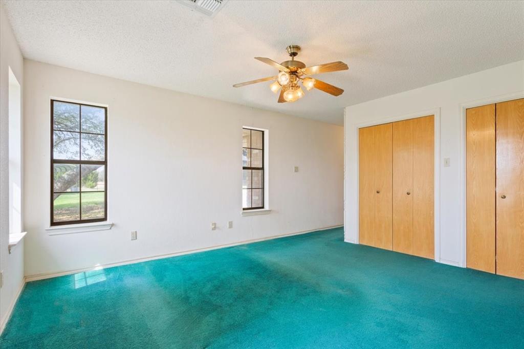 146 Indian Paint Brush Road Eddy, TX 76524 - Photo 18 of 38 a view of an empty room with window and wooden floor