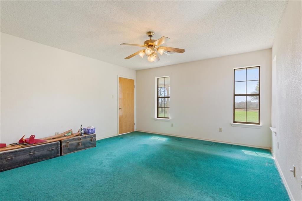 146 Indian Paint Brush Road Eddy, TX 76524 - Photo 19 of 38 an empty room with windows