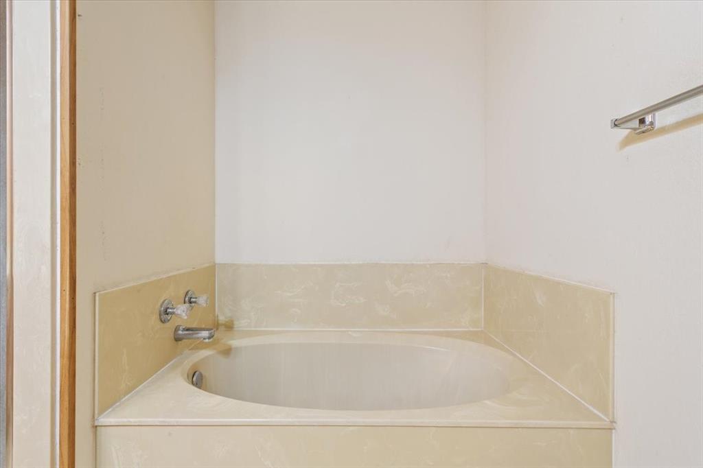 146 Indian Paint Brush Road Eddy, TX 76524 - Photo 23 of 38 a close up of a bathtub in a bathroom
