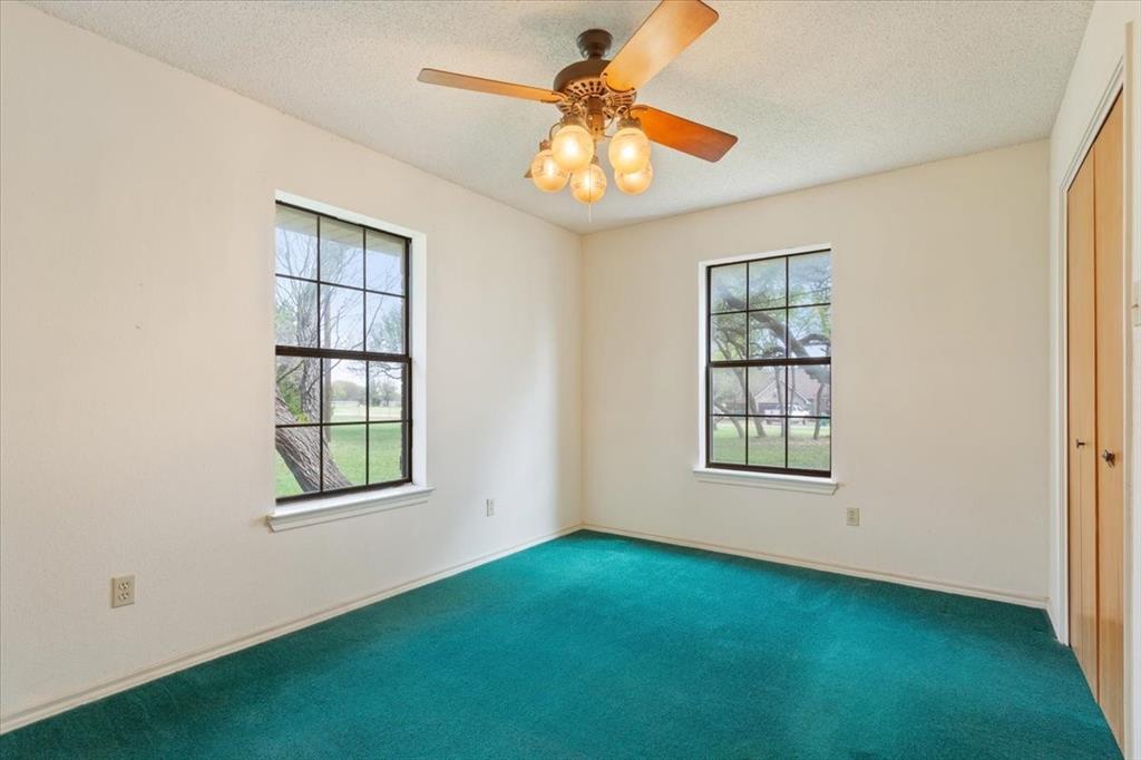 146 Indian Paint Brush Road Eddy, TX 76524 - Photo 25 of 38 an empty room with windows and fan