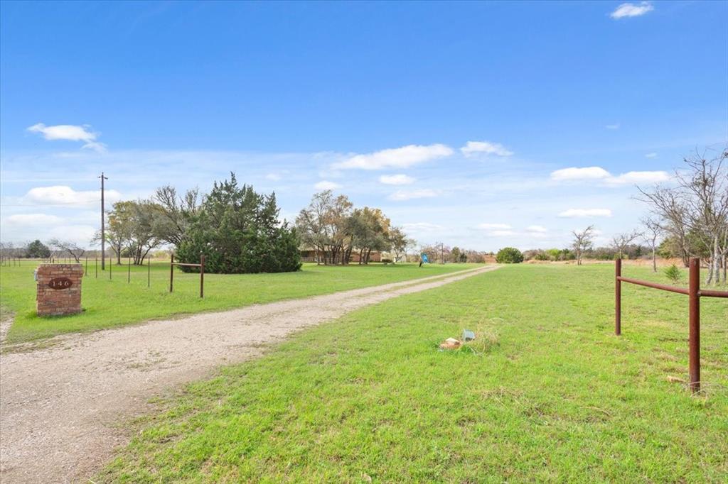 146 Indian Paint Brush Road Eddy, TX 76524 - Photo 34 of 38 a view of a golf course with a lake view