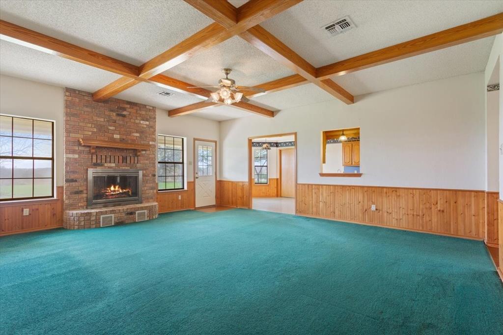146 Indian Paint Brush Road Eddy, TX 76524 - Photo 6 of 38 a view of an empty room with a fireplace and a window