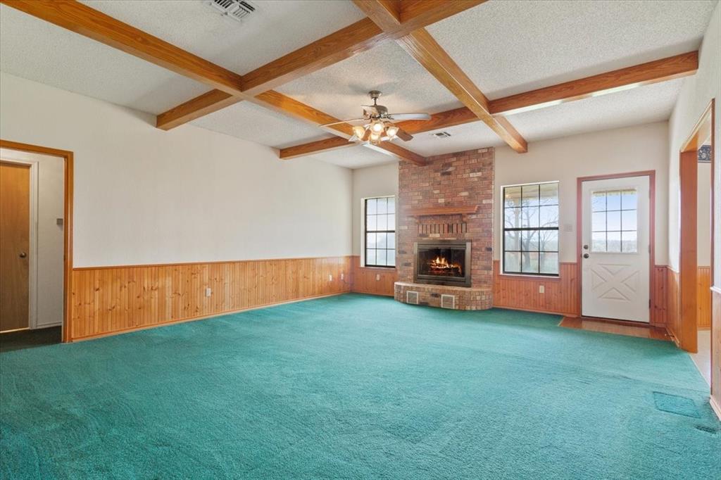 146 Indian Paint Brush Road Eddy, TX 76524 - Photo 7 of 38 a view of an empty room with window and fireplace