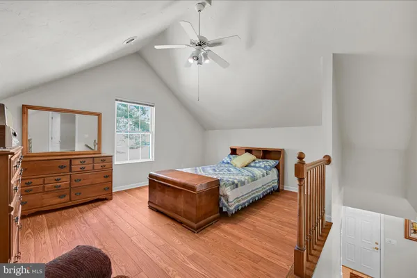 a bedroom with furniture and window