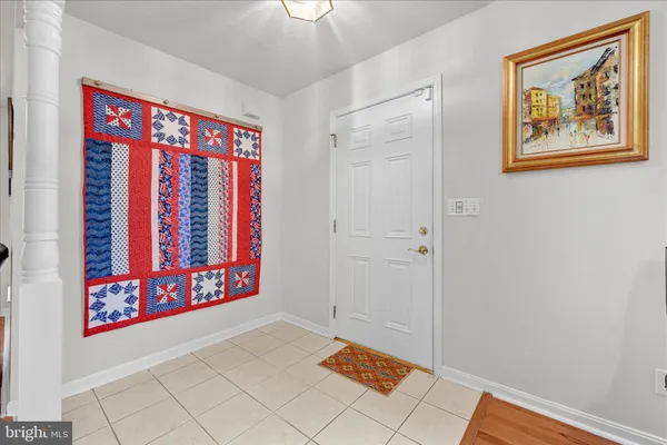 a view of front door with wooden floor