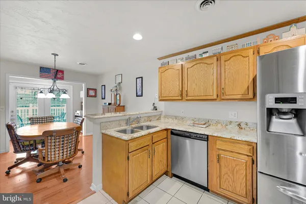 a kitchen with a sink stove and white cabinets