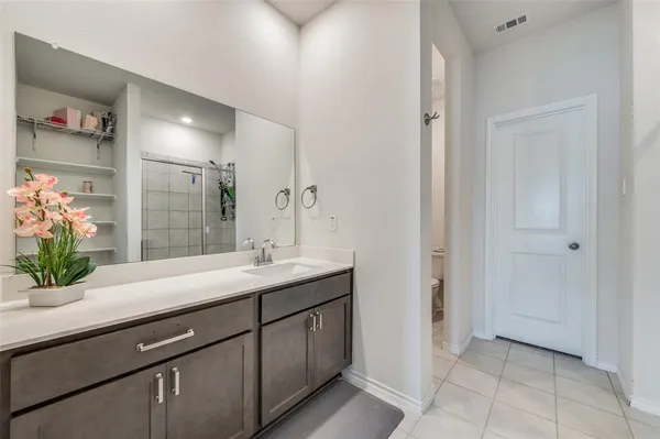 a living room with furniture and a view of kitchen