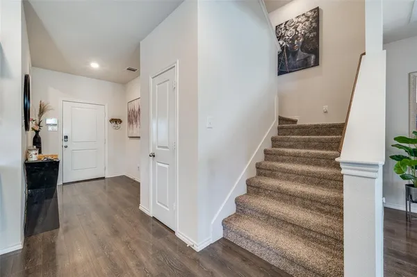 a view of entryway with wooden floor