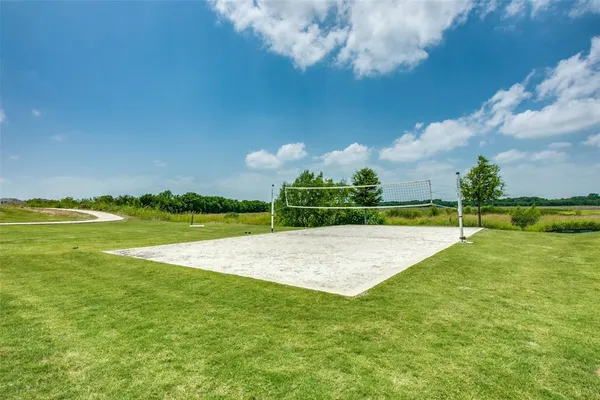 a view of a swimming pool and a yard