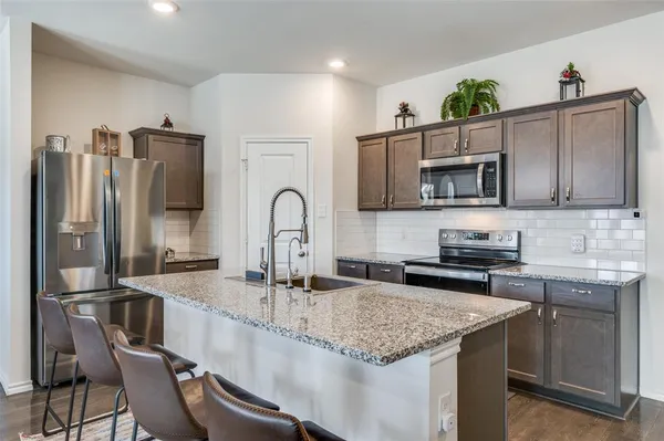 a kitchen with granite countertop lots of counter top space