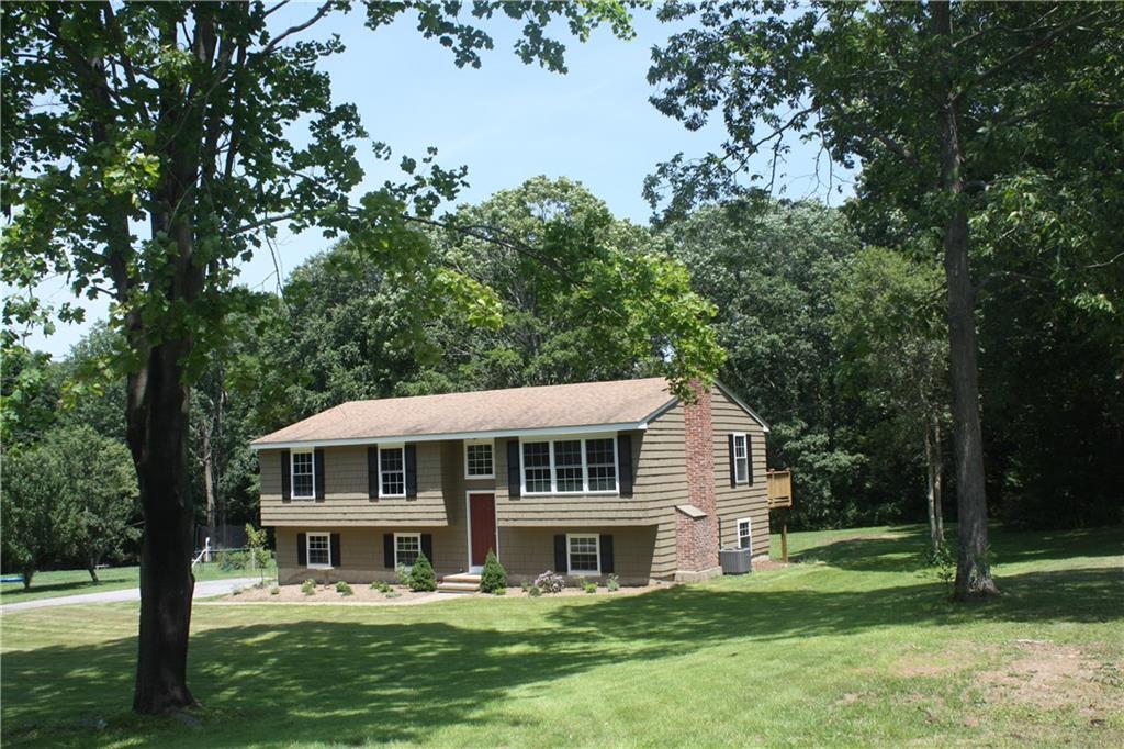 a front view of a house with a yard