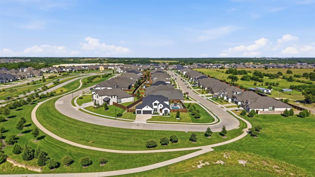 4202 Crown Run Road Midlothian, TX 76065 - Photo 34 of 34 Aerial perspective showcasing a curvilinear street layout with individual residential properties