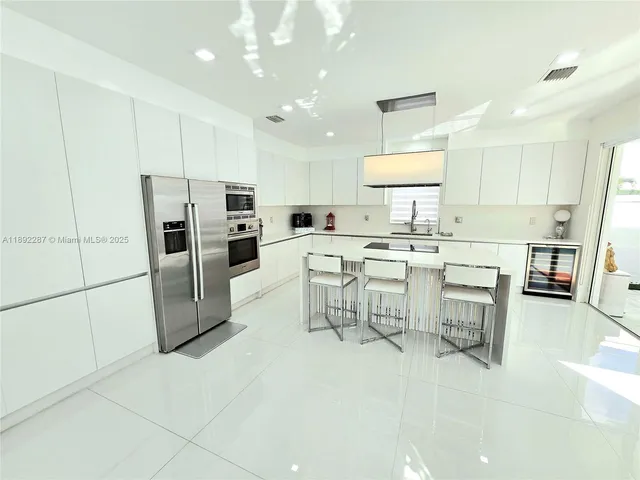 a large kitchen with cabinets