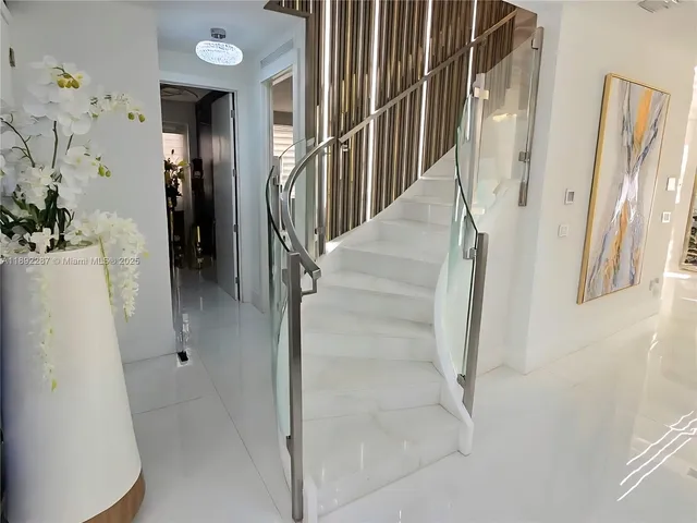 a view of staircase with white walls
