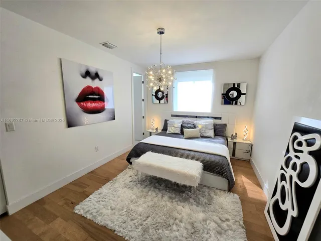 a bedroom with bed and a window