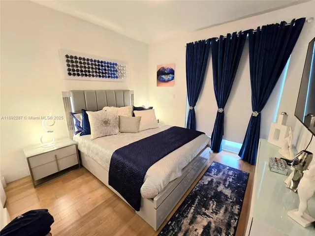 a bedroom with a bed and a walk in closet