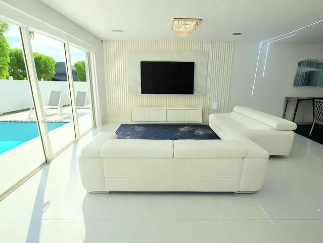 a living room with a large window and a flat screen tv