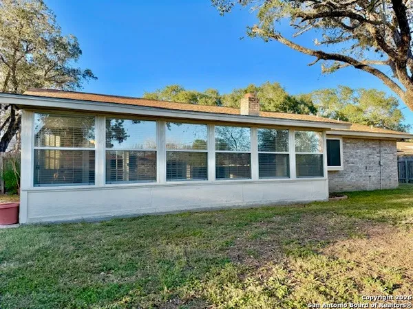front view of a house with a garden
