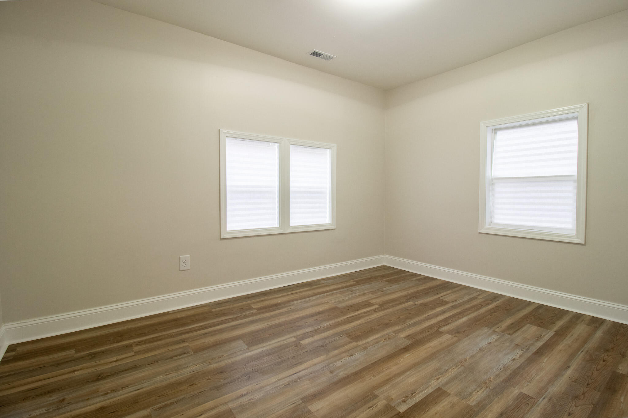 1755 Ralston Street Gary, IN 46406 - Photo 18 of 29 a view of an empty room with wooden floor and a window