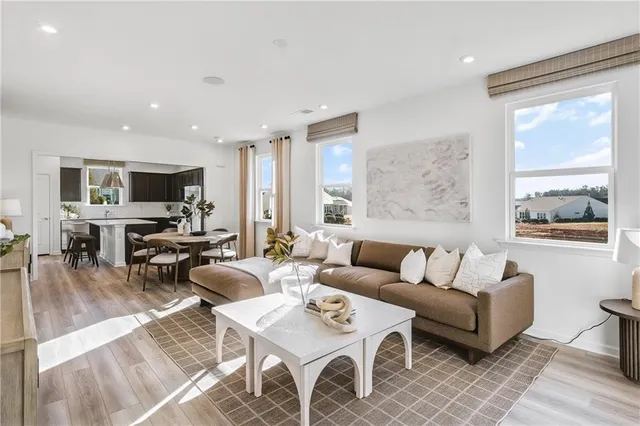 a living room with fireplace furniture and a flat screen tv