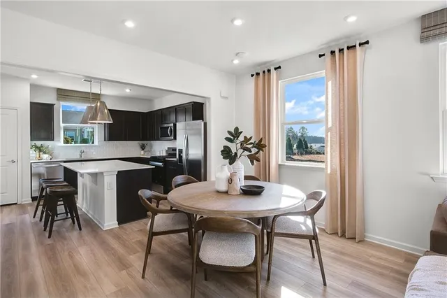 a kitchen with a table and chairs in it