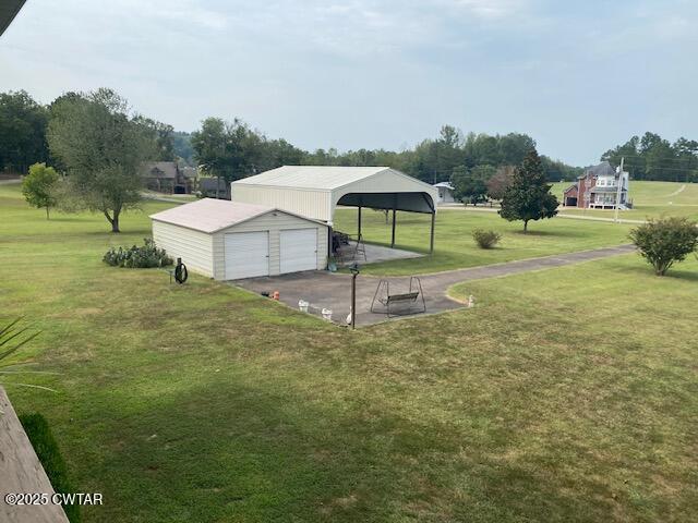 3643 Mt Carmel Road Decaturville, TN 38329 - Photo 42 of 71 a backyard of a house with table and chairs