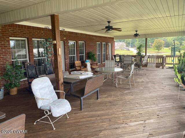 3643 Mt Carmel Road Decaturville, TN 38329 - Photo 43 of 71 a view of a dining room with furniture wooden floor and chandelier